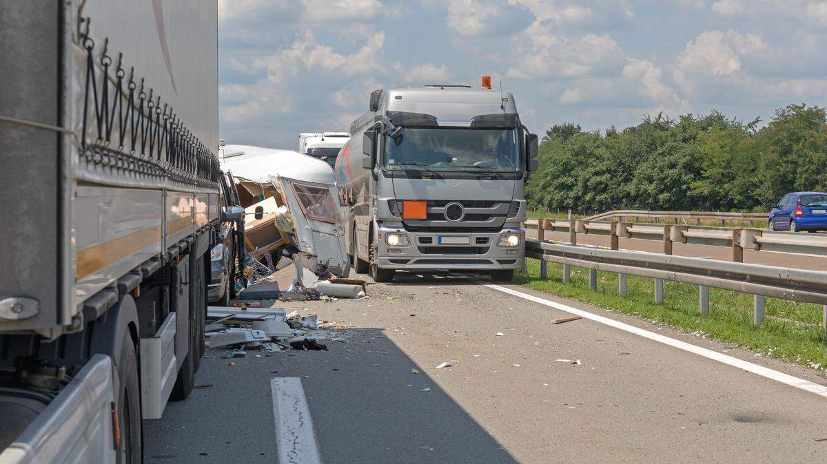 Semi Trucks and Camper Trailer Traffic Accident at Highway