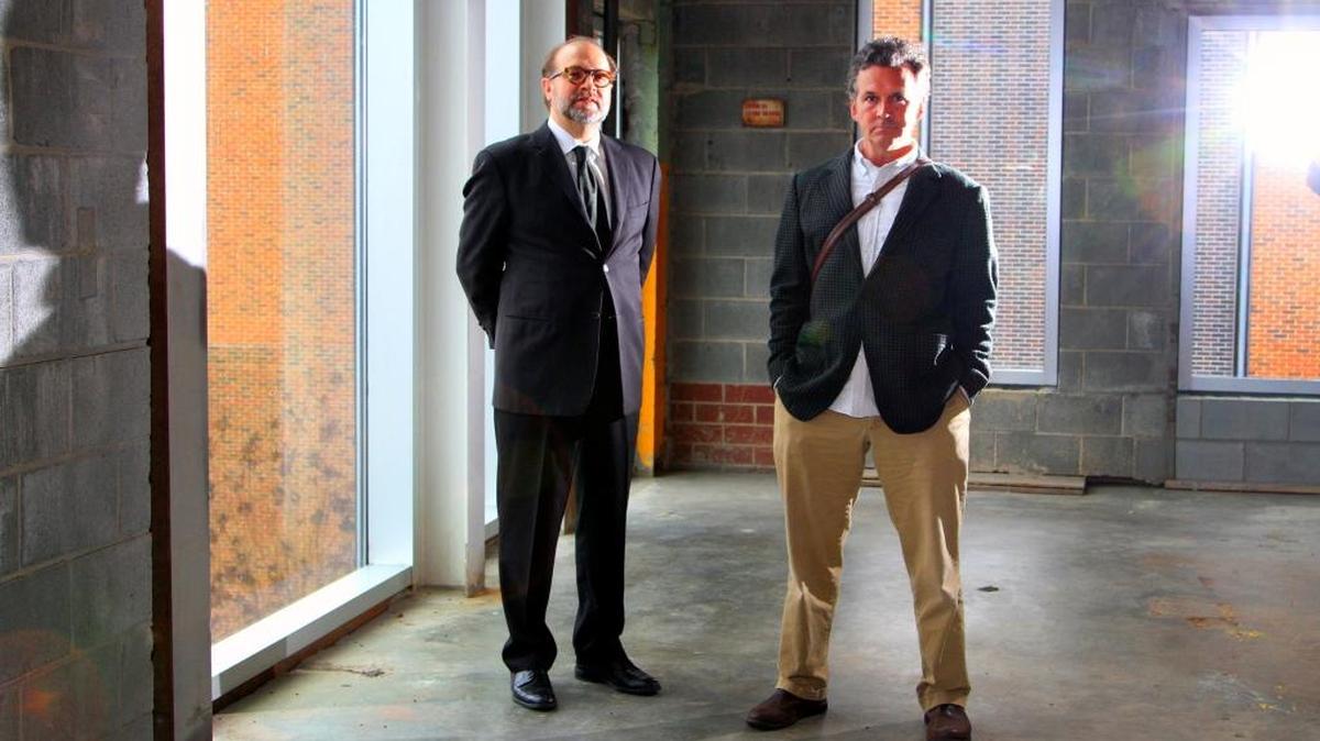 David Houston, the director of the Bo Bartlett Center at Columbus State University, left, and artist Bo Bartlett are photographed in the large space inside the Corn Center for the Visual Arts that will house the Bartlett Center.