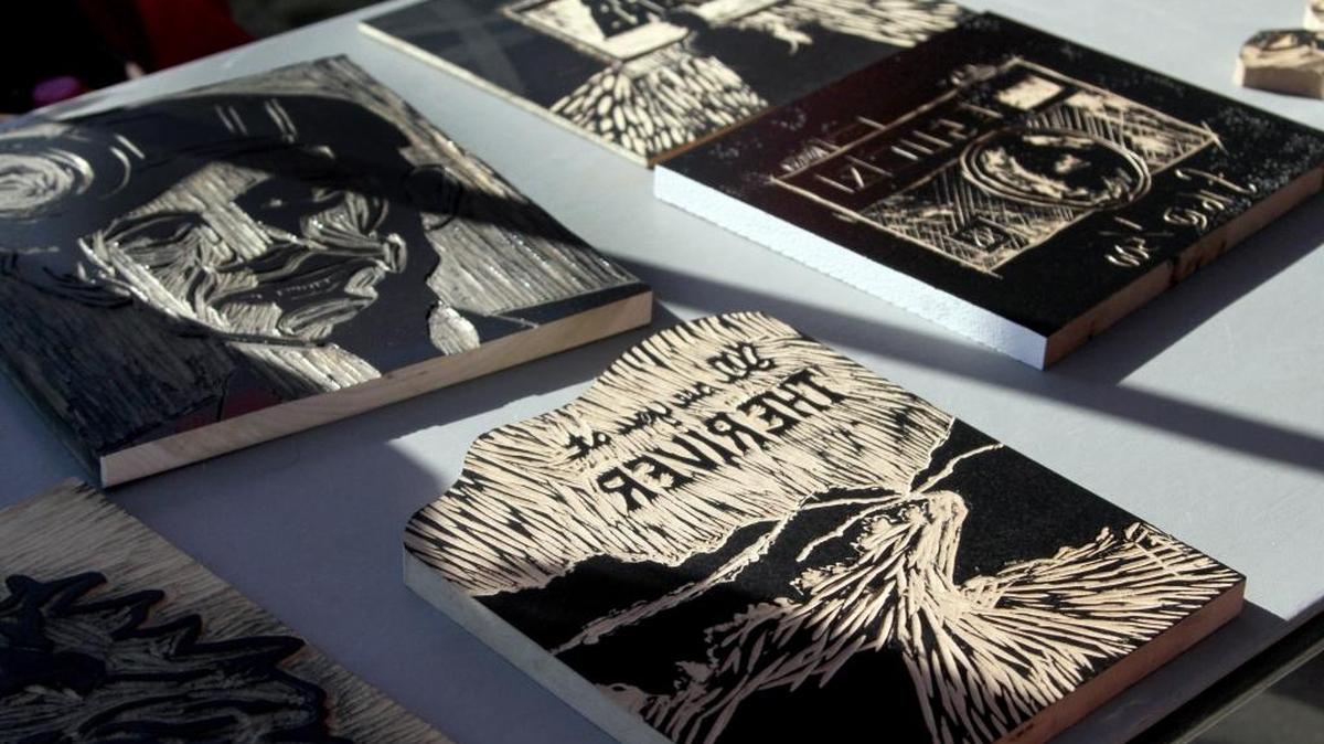 These wooden blocks are covered with an oil-based ink before they are screen printed onto various colored T-shirts at ArtBeat in 2013.