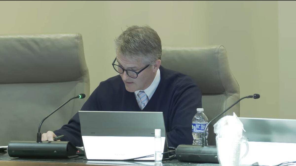 During the Dec. 16, 2025, Columbus Council meeting, Councilor John Anker of citywide District 9 reads a statement criticizing Mayor Skip Henderson for pausing the search for a new city manager.
