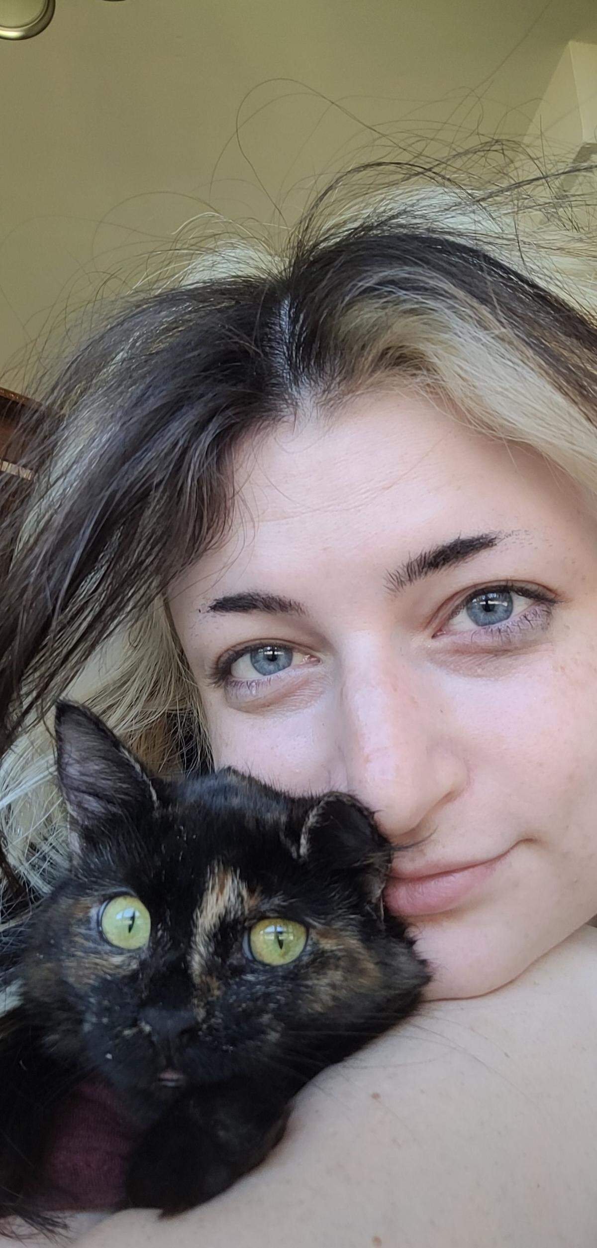 Chelle Leary and her cat Burnt Toast were in her apartment watching television when a stray bullet came in through her ceiling on New Year’s Eve in 2022.