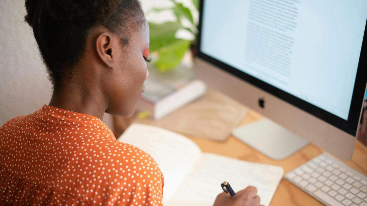 https://www.pexels.com/photo/woman-writing-on-her-notebook-3059747/
