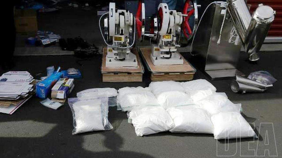 A Drug Enforcement Administration photo of confiscated pill presses and powdered fentanyl.