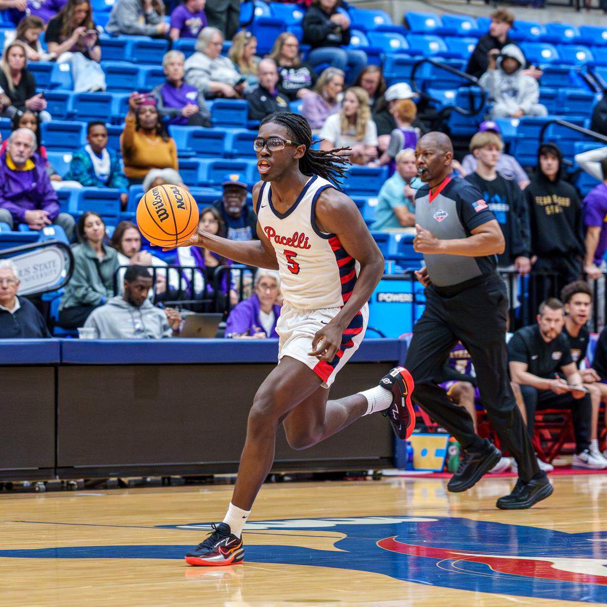 St. Anne-Pacelli Catholic School senior guard Mikehi Williams dribbles the ball during the Georgia Independent Athletic Association Class AAAA boys basketball title game Feb. 28, 2026, at Columbus State University. The Vikings won their third straight state championship by overcoming a 10-point halftime deficit and persevering 55-52 against the Athens Christian Eagles.