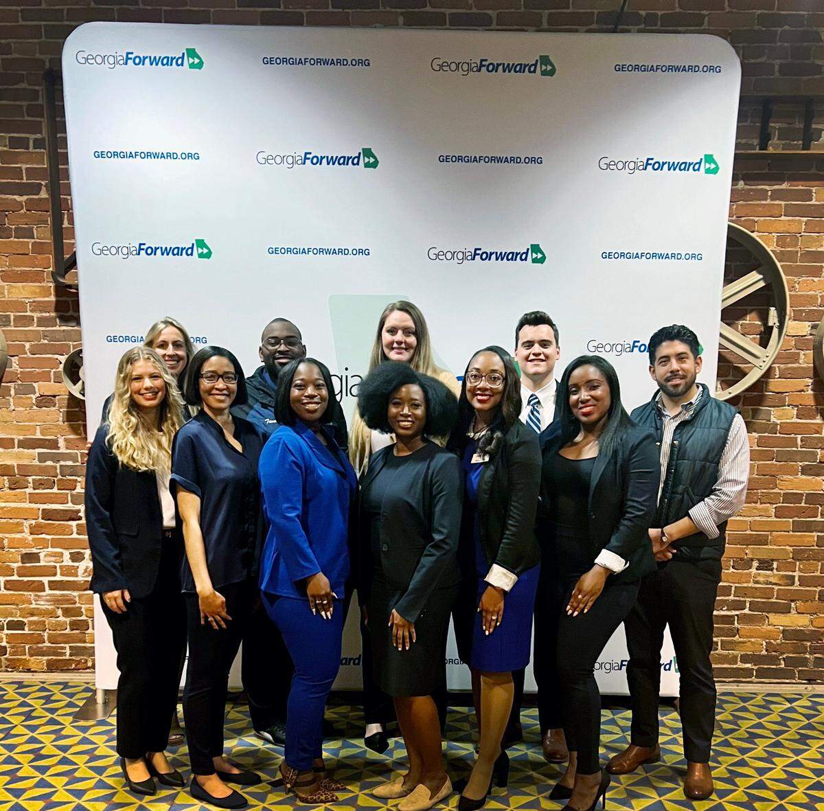 The group South Columbus Soul, a small group of Gamechangers tasked with working on addressing economic disparity and economic mobility in South Columbus., pose for a photo. They are: front row, left to right: Kelsie Kruskol, Rachael Lambert, Divisha Bradley, Ashley Nealy, Maegan Day, and Erica Walker. The back row, left to right, are Rebecca Zajac, Tavari Turner, Elizabeth Banks, Will Newton, and Patrick Rodriguez.