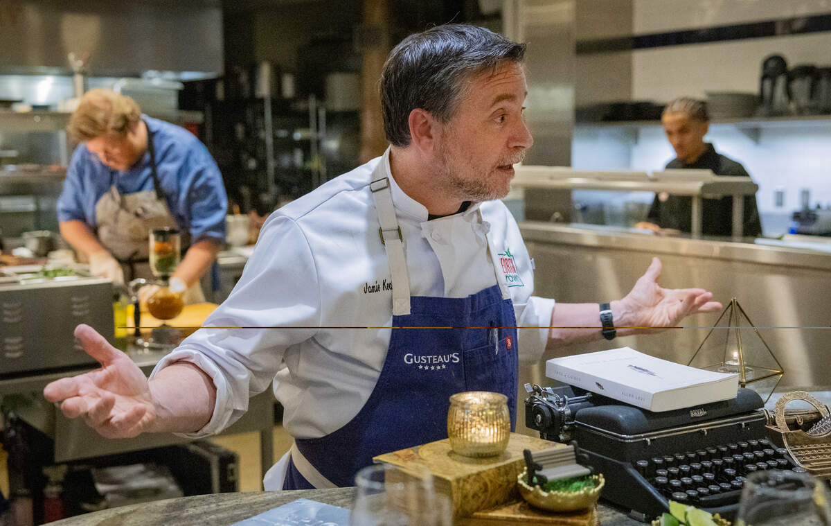 Chef Jamie Keating speaks with a group from Florida who booked a chef’s table dinner experience based on Allen Levi’s novel “Theo of Golden” at Epic Restaurant in Columbus.