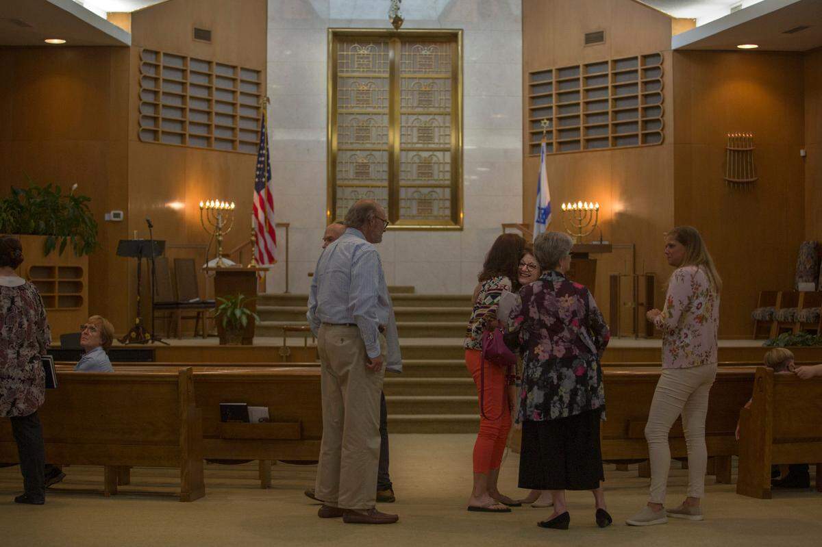 Rabbi Beth Schwartz hugs congregants before Shabbat service at Temple Israel on June 18, 2021, in Columbus, Ga.