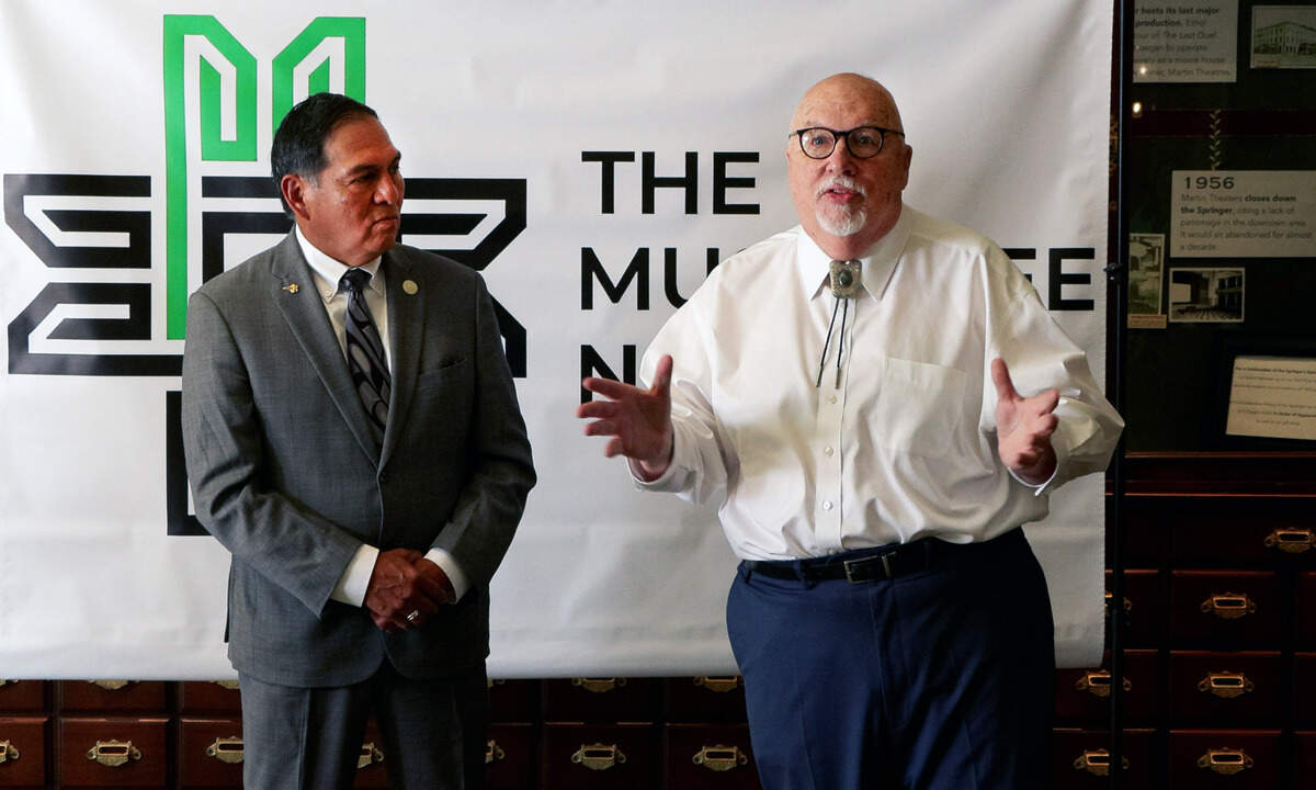 Principal Chief David Hill of the Muscogee (Creek) Nation, left, listens as Springer Opera House senior adviser Paul Pierce speaks during a gathering at the Springer on Sept. 15, 2025, in Columbus. Officials announced the Native American tribe will have a permanent office inside Columbus City Hall.
