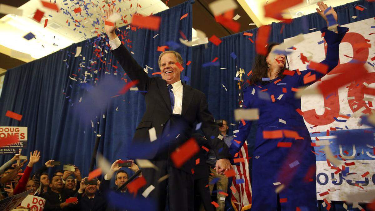 Democratic candidate for U.S. Senate Doug Jones and his wife Louise wave to supporters before speaking during an election-night watch party Tuesday, Dec. 12, 2017, in Birmingham , Ala. Jones defeated Republican Roy Moore.