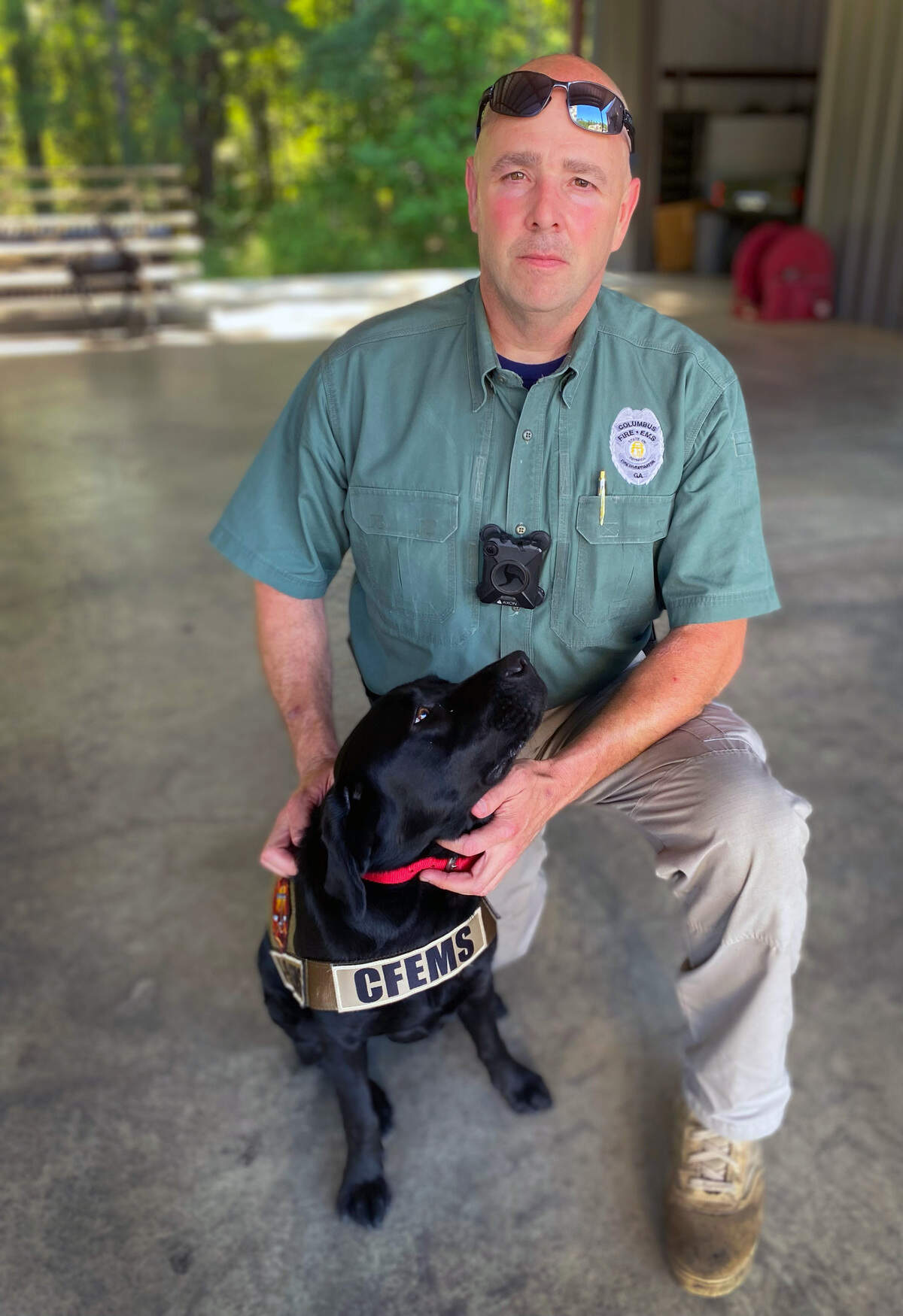 Sgt. Robert Collins, a fire investigator with Columbus Fire and Emergency Medical Services in Columbus, Georgia, is photographed with Carter. They recently successfully courses and testing at the Maine Accelerant Detection Canine School and are considered to be a canine accelerant detection team. 06/08/2022