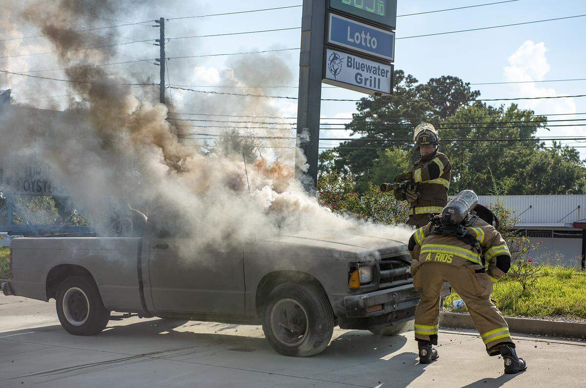 Firefighters from Station 11 putting out a truck fire at 4640 Warm Springs Road in front of the BlueWater Grill restaurant, Wednesday evening, July 25, 2018 