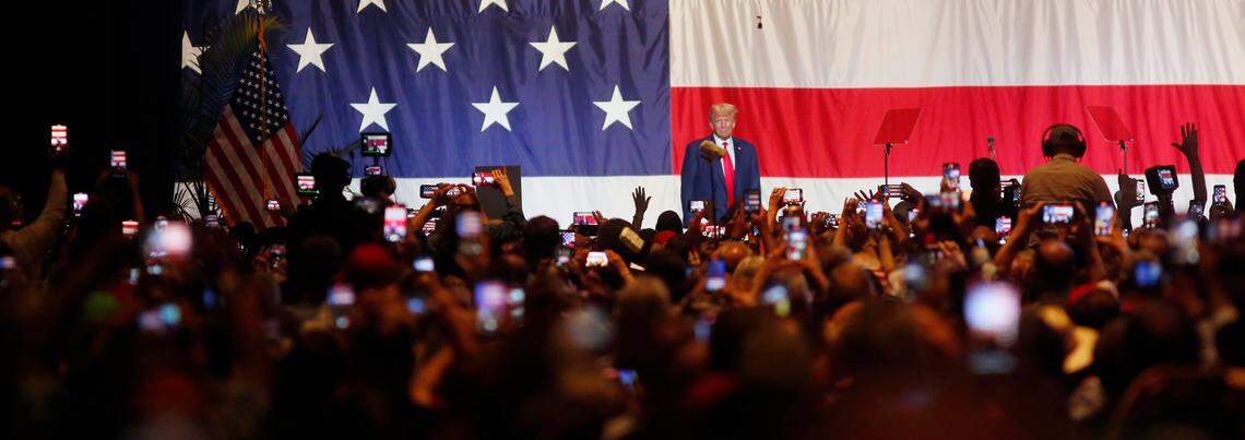 Former President Donald Trump walks onto the stage at the Columbus Convention & Trade Center Saturday afternoon during the Georgia GOP state convention. 06/10/2023