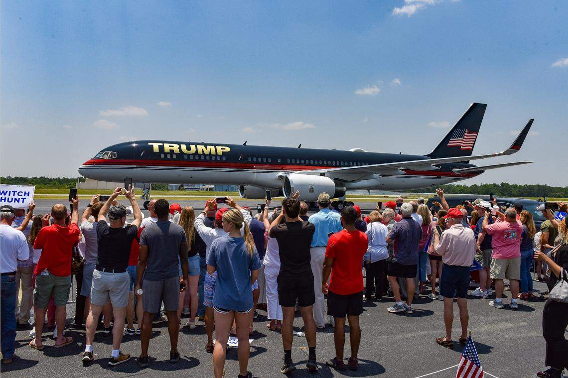 Hundreds of fans wait to greet former President Donald J. Trump at the Flightways terminal at the Columbus Airport Saturday.