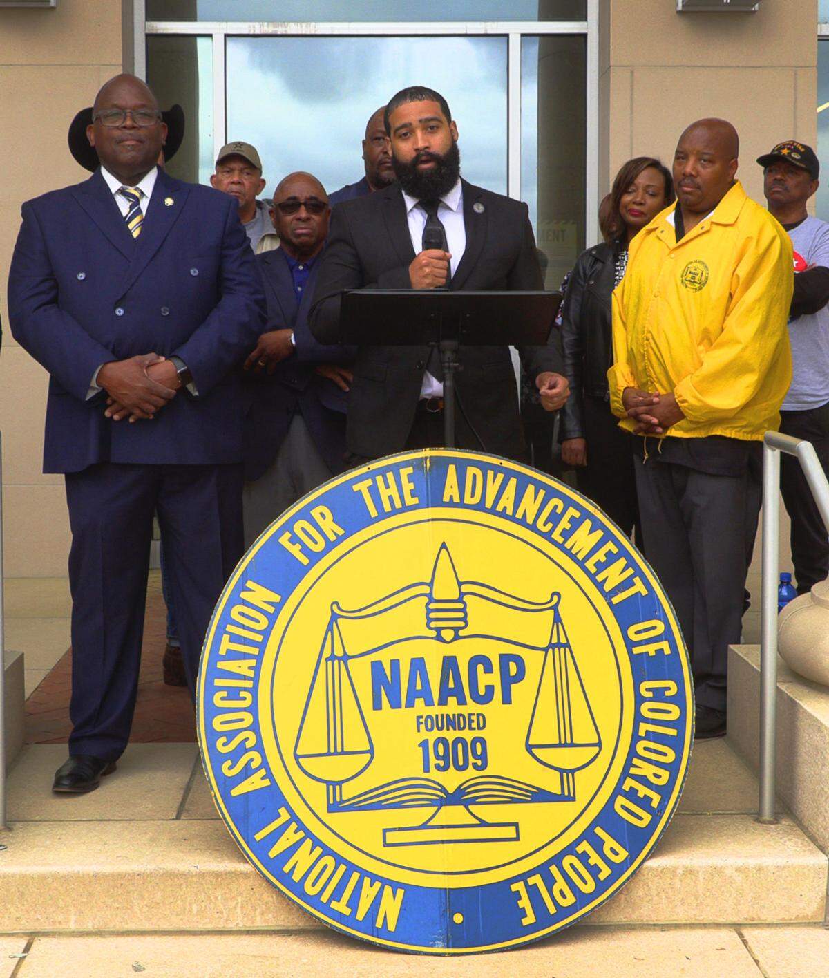 Lucas Melton, a member of the NAACP’s Political Action Committee, speaks during a Monday afternoon news conference on the steps of the Citizens Service Center in Columbus, Georgia, related to the appointment and swearing in of John Anker as a Columbus Councilor. 03/24/2025