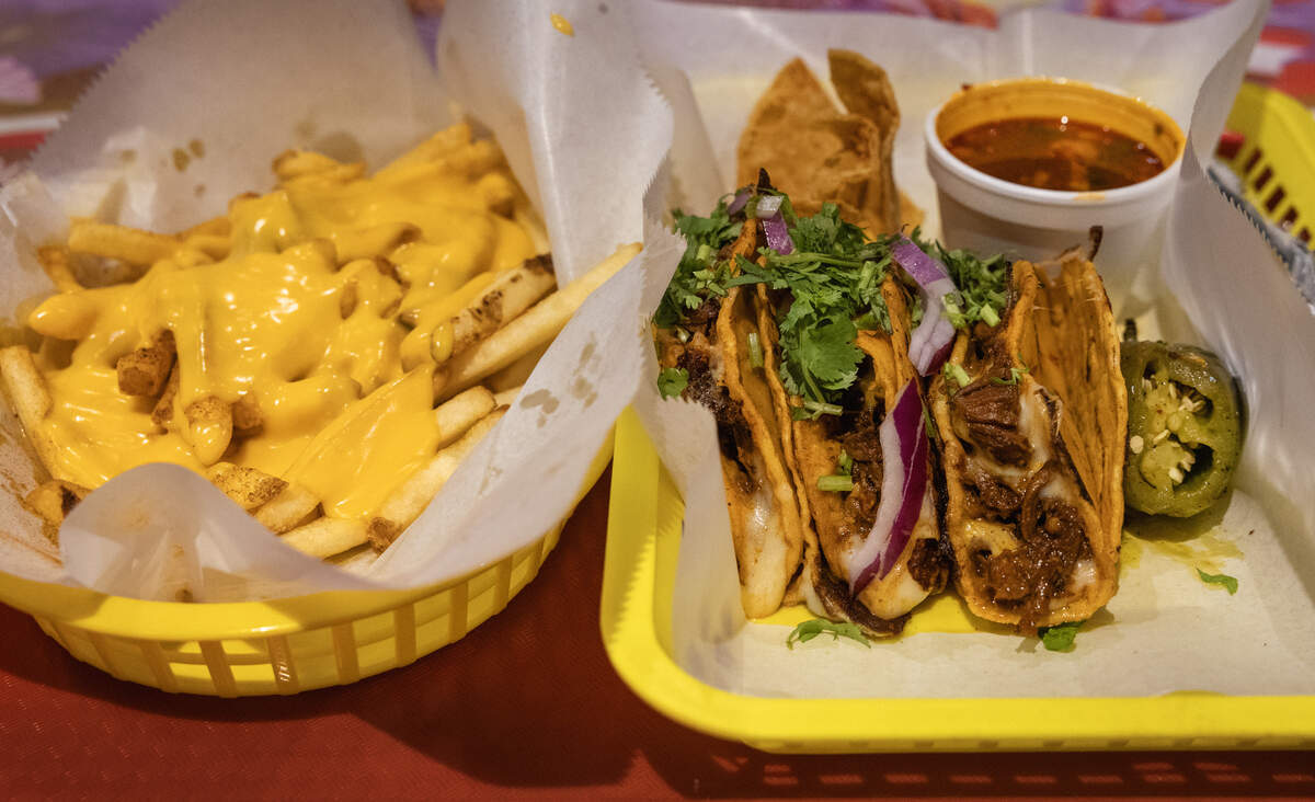 Ledger-Enquirer reporter Kelby Hutchison ordered cheese fries, three quesabirria tacos, and a churro(not pictured) during his first trip to Tacos El Paisa, the newest Mexican restaurant to join the scene on Broadway in downtown Columbus, Georgia. 07/02/2026