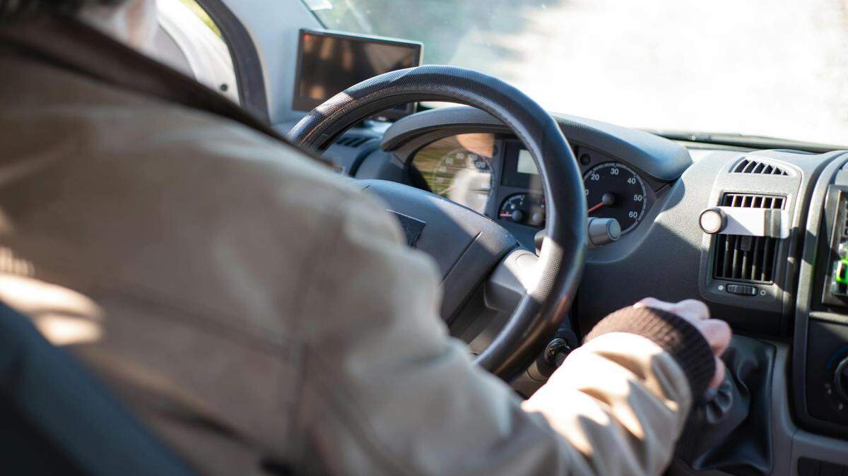 https://www.pexels.com/photo/person-in-white-long-sleeve-shirt-driving-car-7476897/