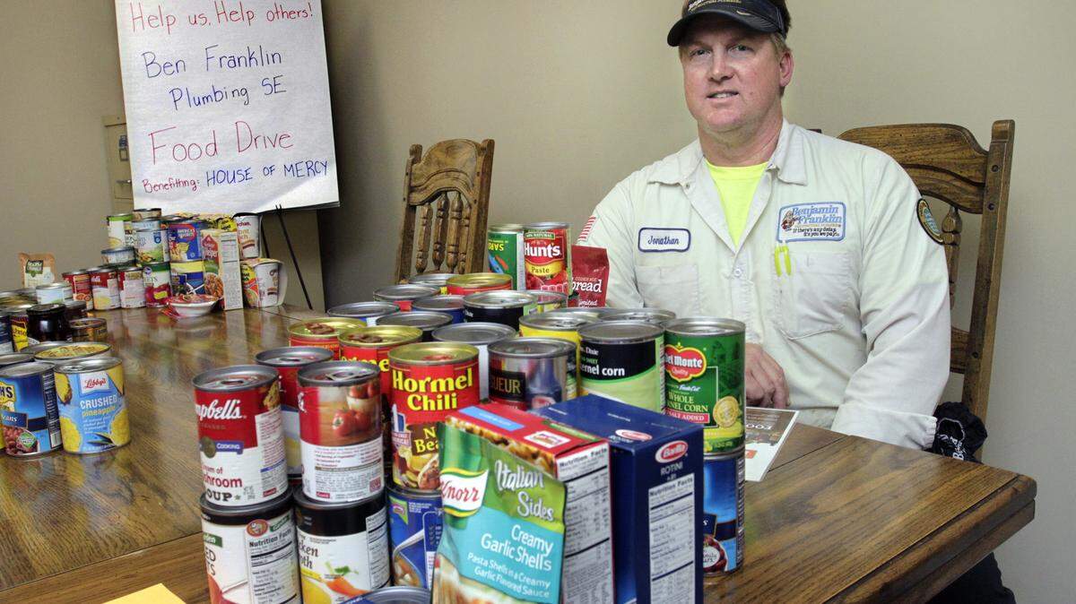 ROBIN TRIMARCHI rtrimarchi@ledger-enquirer.com 
 Jonathan Meigs and his coworkers at Benjamin Franklin Plumbing are collecting non-perishable food items to benefit the House of Mercy during the Christmas holiday. The company donated food for Thanksgiving, and is replenishing its food bank for the holidays. 12.01.15