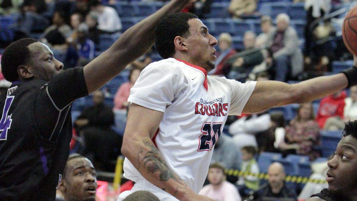 ROBIN TRIMARCHI rtrimarchi@ledger-enquirer.com 
 Columbus State's Brent Jackson makes a shot against Marques McKay of Young Harris College in Peach Belt conference play Saturday at the Lumpkin Center. 02.13.16
