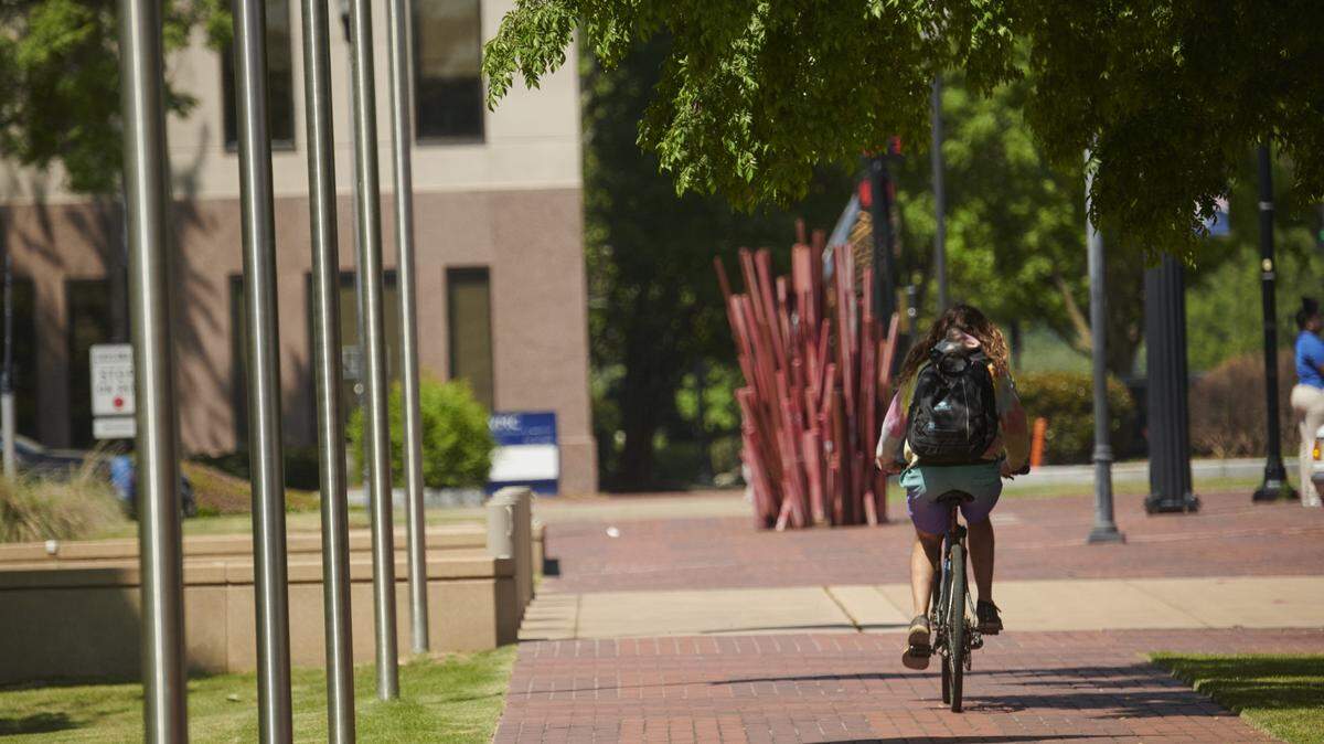 A biker riding in uptown Columbus, Georgia in 2023. The city is looking to finalize its Municipal Transportation Plan for the next several years.