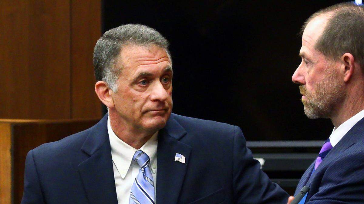 Assistant District Attorney Peter Hoffman, left, speaks with Jeff Carter, an investigator with the District Attorney’s office, Thursday morning prior to court beginning for the day. 06/16/2022