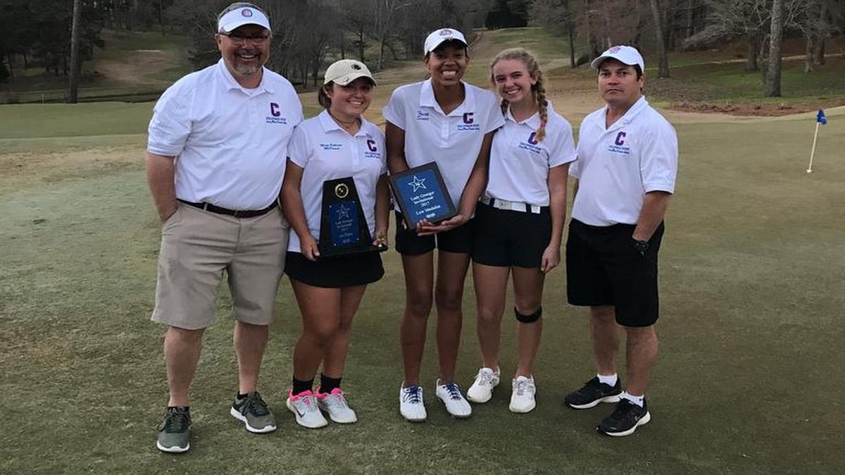 Columbus head coach Joe McDaniel, Mary Catherine McDaniel, Faith Scott, Maddy Krueger and assistant coach Felix Rijos celebrate after winning the Lady Granger Invitational in LaGrange on March 20, 2017.