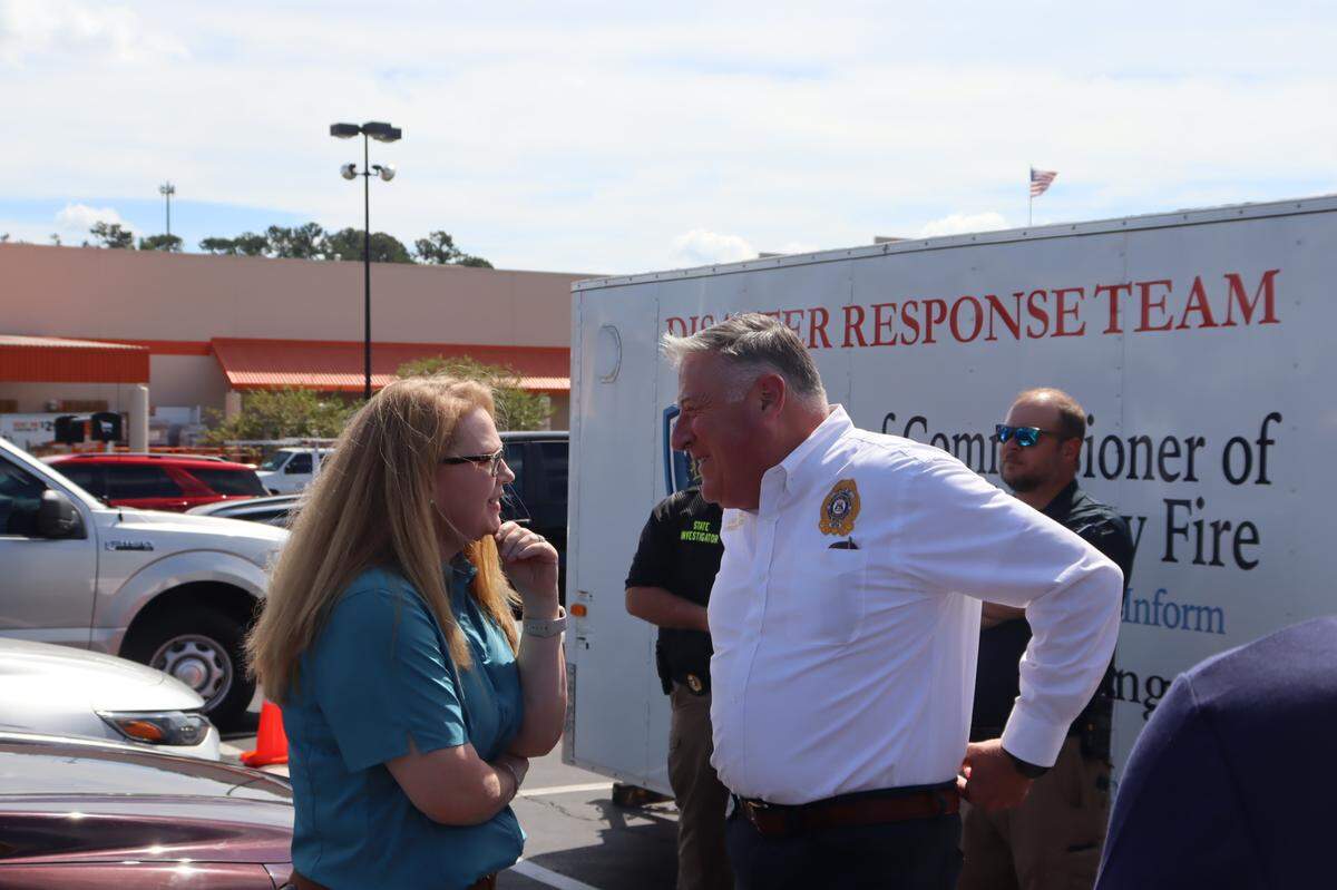 Paige Duke, County Manager of Lowndes County thanks Georgia Insurance Commissioner John King for setting up a Insurance Village Claim center at Home Depot in Valdosta on October 3, 2024.
