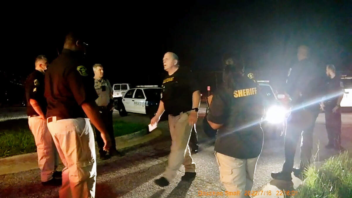 Lt. Donald Nestor with the Muscogee County Sheriff’s Office, center, works to diffuse a situation between sheriff’s deputies and Columbus Police officers on July 16, 2022 at the Muscogee County Jail. 7/16/2022