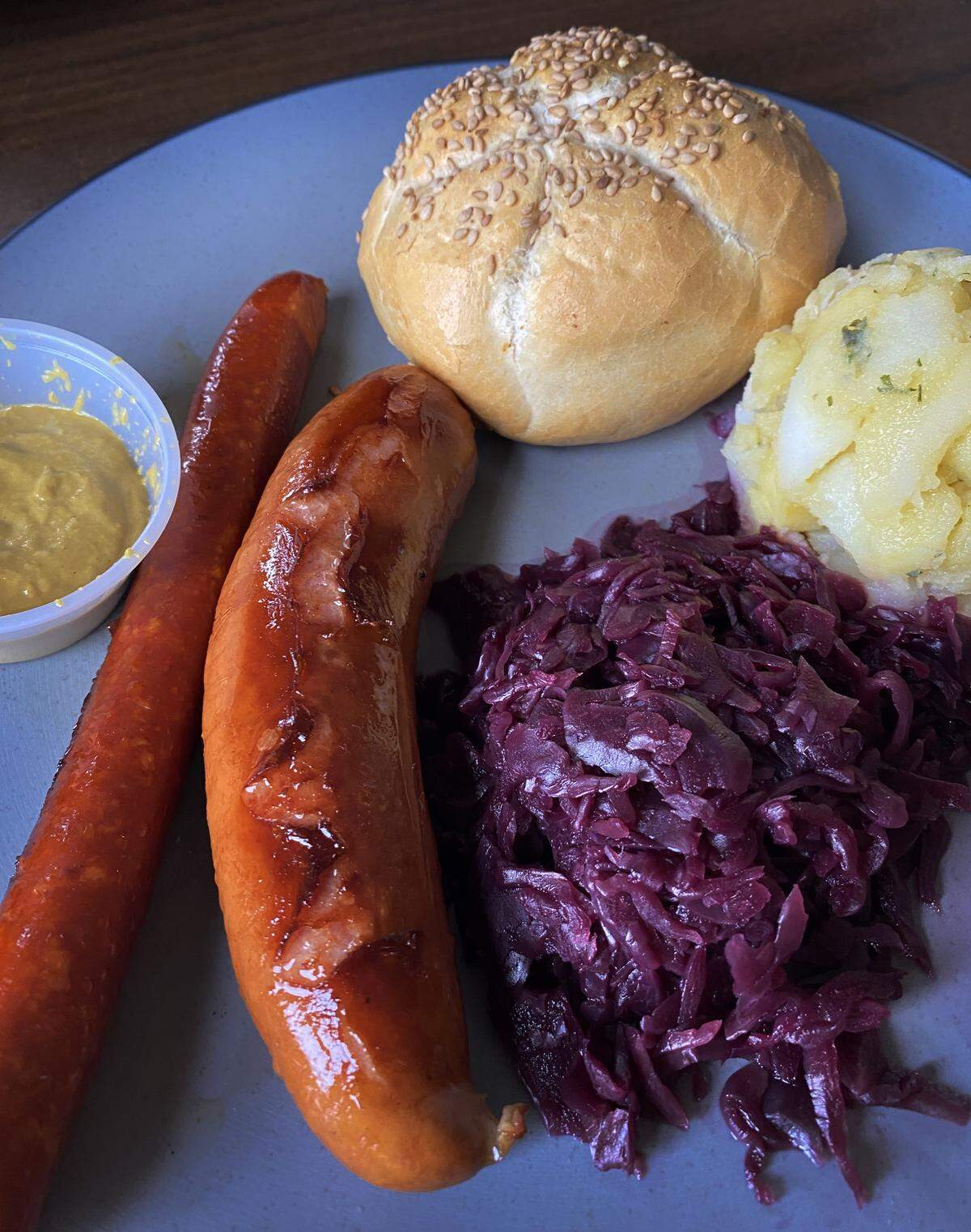 Ledger-Enquirer visual journalist Mike Haskey ordered a lunch plate with Thüringer and Debreziner sausages, purple cabbage, German potato salad, and a bread roll at The Schnitzel Lot/German Food Gifts & More in Phenix City.