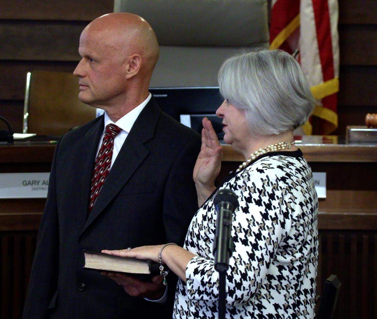 Charmaine Crabb is sworn in Monday morning as the newest member of Columbus City Council during an installation ceremony at the Citizen’s Service Center in Columbus, Ga. Holding the bible os Crabb’s husband, Tim.