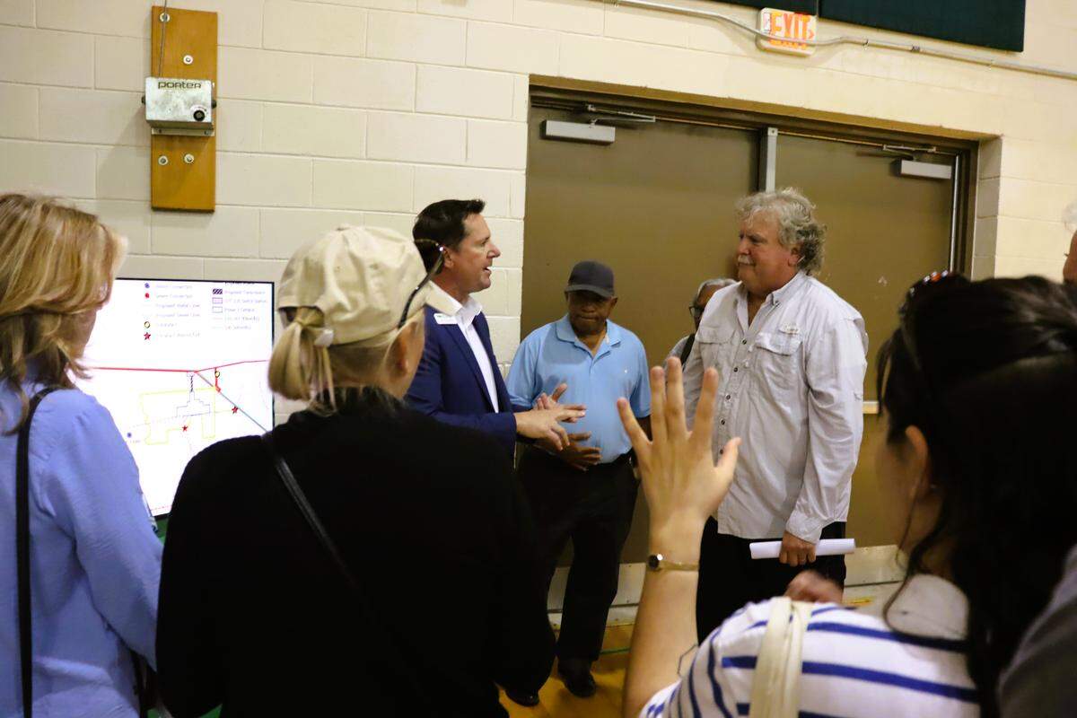 During a forum March 23, 2026, at the Psalmond Road Recreation Center in Columbus, residents ask Jay Flesher, community engagement director for Flint Energy, about Project Ruby, a proposed hyperscale data center.
