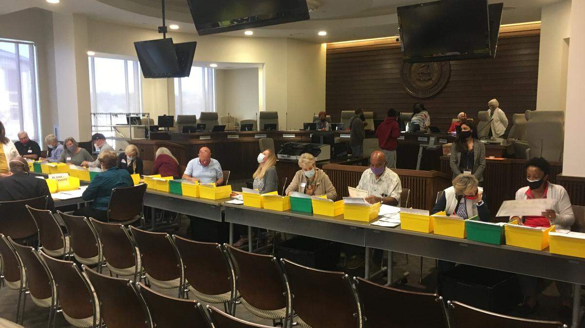 Election volunteers in Muscogee County count ballots from the presidential race as part of a statewide audit on November 13, 2020.