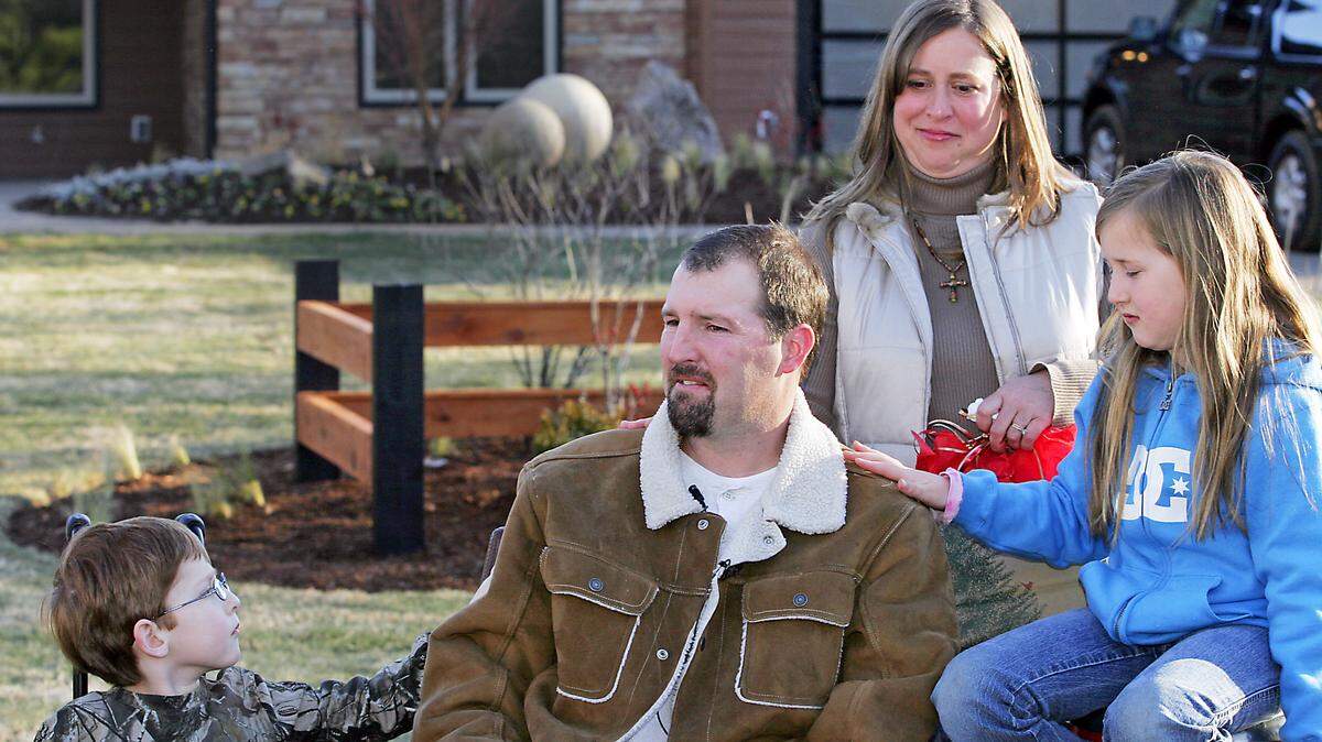 Jeremy Williams is joined by his son Jacob, daughter Josie, and wife Jennifer, outside of their new Harris County home in 2010 after appearing on the “Extreme Makeover: Home Edition” TV show.