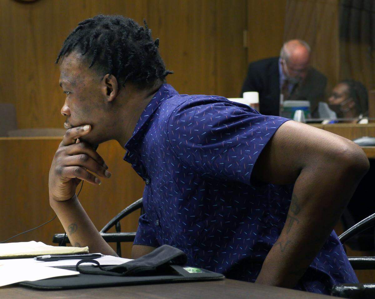 Demetrius Johnson listens as witness Erica Danielle Streeter testifies Thursday morning. 12/09/2021
