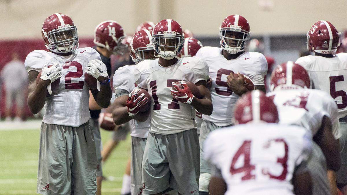VASHA HUNT/AL.com via APAlabama running backs Derrick Henry (2) and Kenyan Drake (17) wait for another turn in drills during football practice Oct. 27 at the Hank Crisp Indoor Facility in Tuscaloosa, Ala.