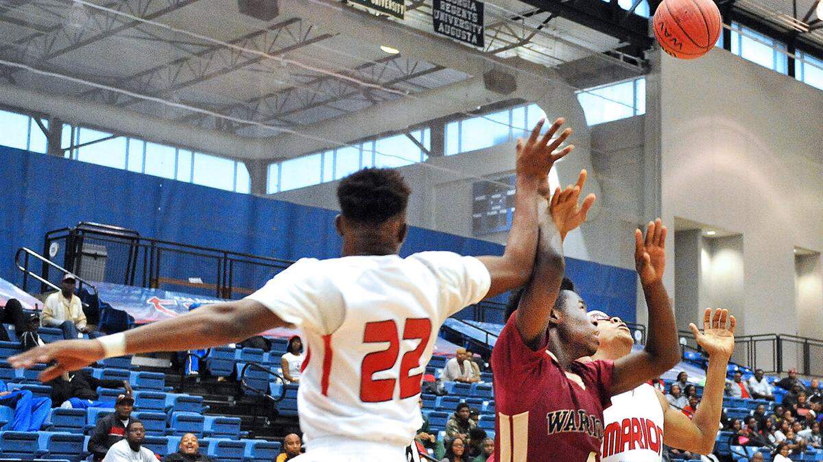 Marion County and Russell County compete for the rebound during the 2015 William Henry Shaw Christmas Tournament.