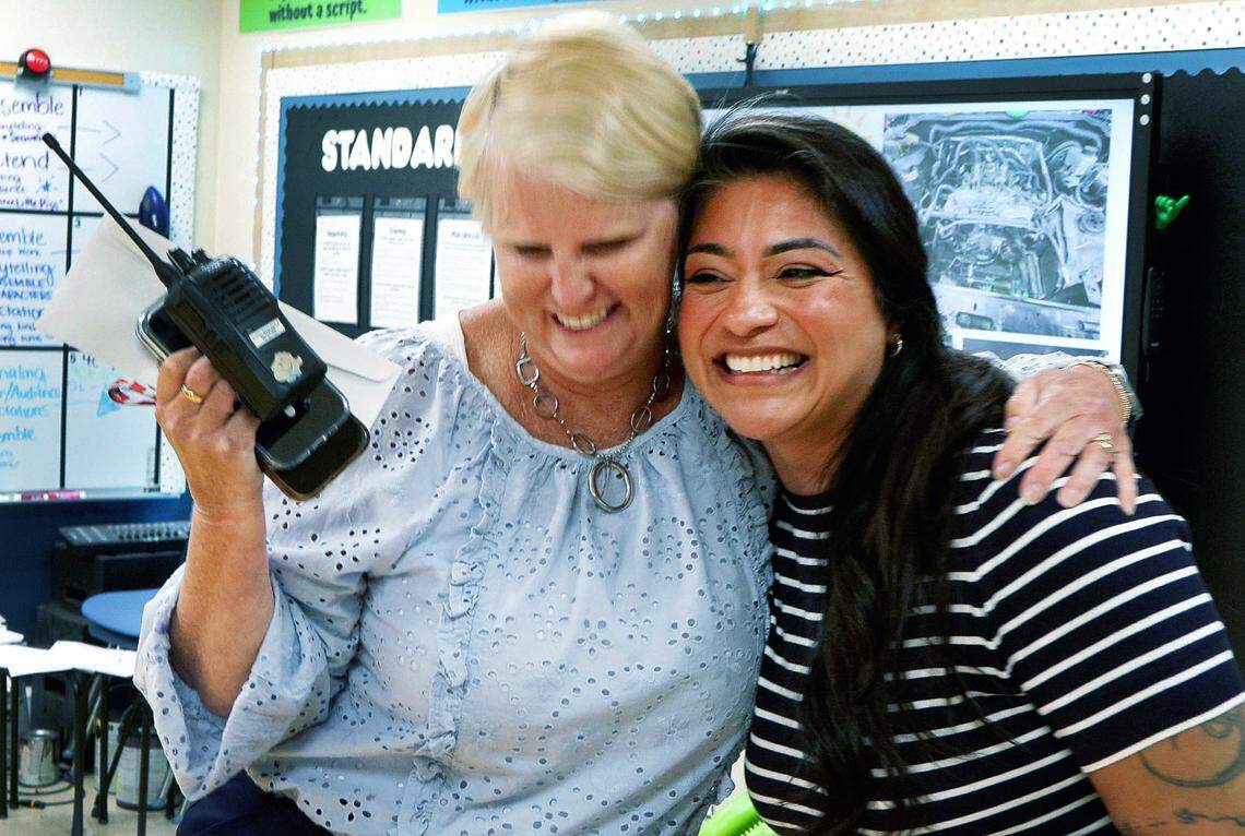 Amanda Zarate, a theater teacher at Wynnton Arts Academy, rights, get a hug from Wynnton principal Jackie Mumpower after Zarate was surprised with the news Tuesday morning that she has been selected as one of three finalists for the Muscogee County School District 2025 Teacher of the Year award. 04/08/2025