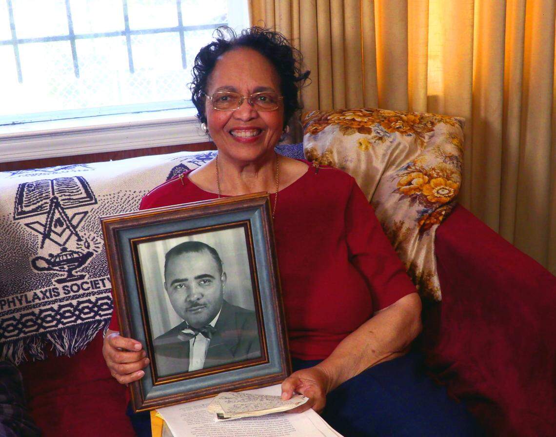 Jettie Nesbitt Lights holds a photograph of her father, D.P. Nesbitt. He was a manager of the theater in Columbus.