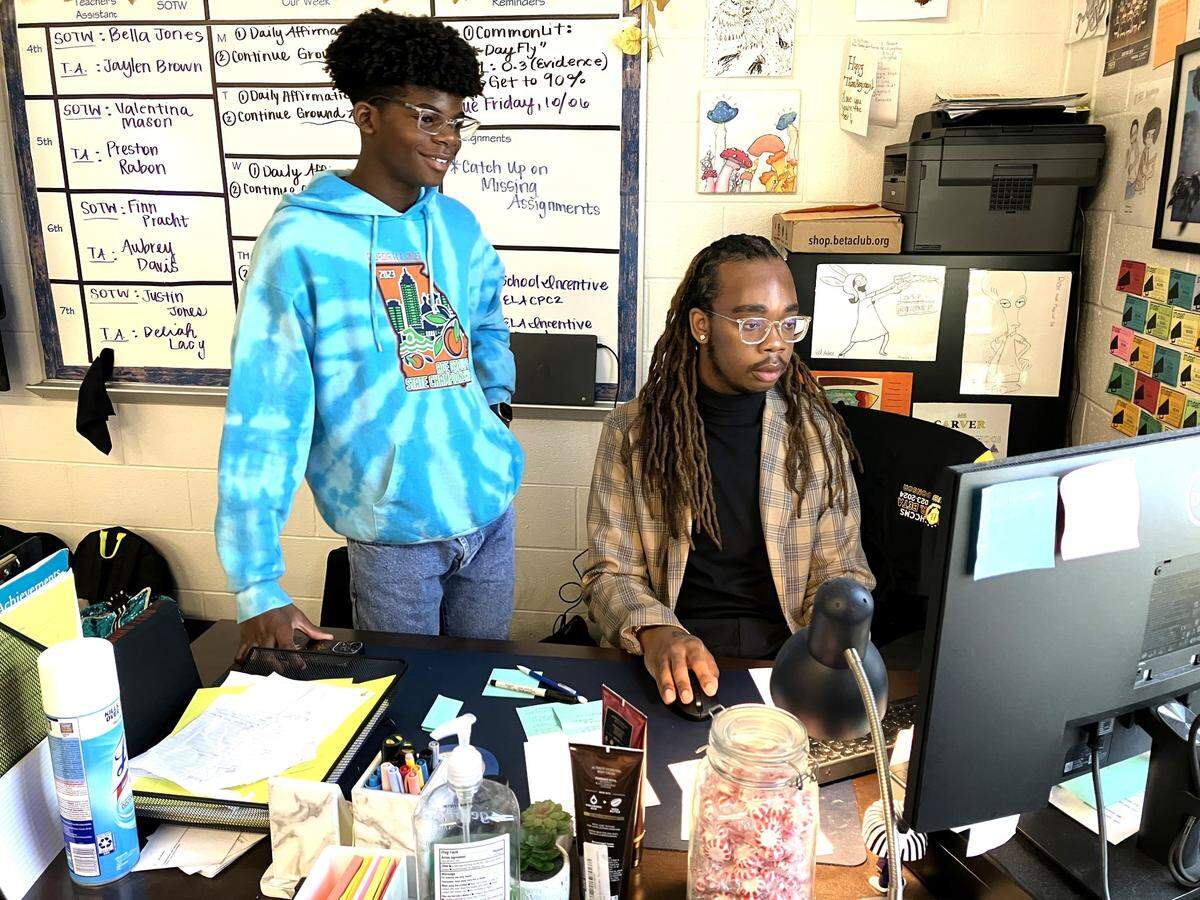 Harris County Carver Middle School eighth-grader Quinton Smith considers English language arts teacher Jalin Murphy a role model. They are pictured Oct. 5, 2023, while Murphy helps Quinton between classes. Murphy is the Harris County School District 2023 Teacher of the Year.