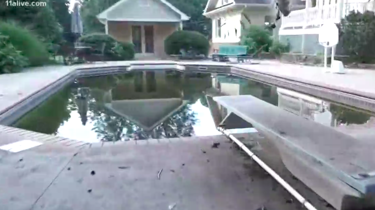 A Forsyth County, Georgia, judge is being hailed as a hero for locating a missing two-year-old after joining in on the search. Judge Phillip Bettis searched an empty home and found the child floating in a swimming pool, pictured here, and rescued him.