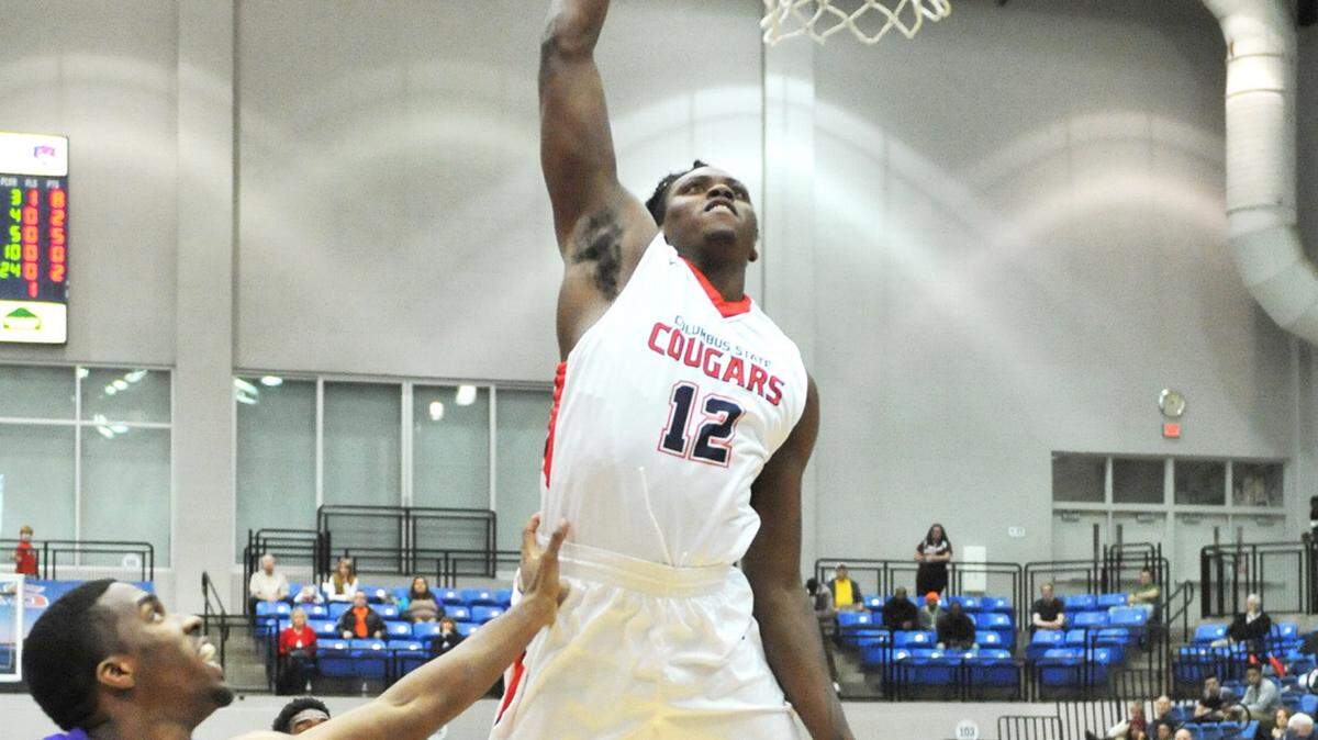 CSU's Brentine Taylor with a slam dunk against Montevallo's Makik Fields Wednesday night February 17, 2016 at the CSU Lumpkin Center