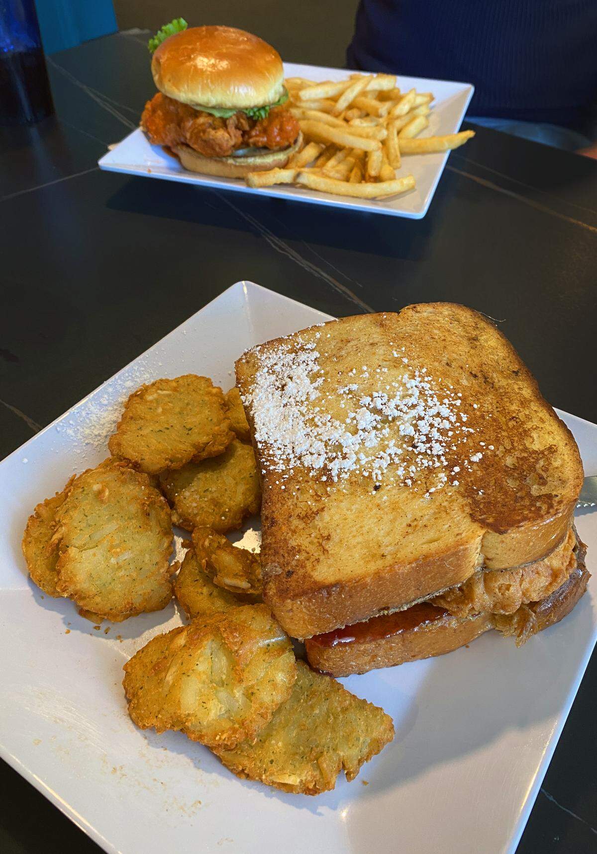 We ordered the Fried & Confused, front, and the Spicy Chicken Sandwich at Toasted in Columbus, Georgia. 