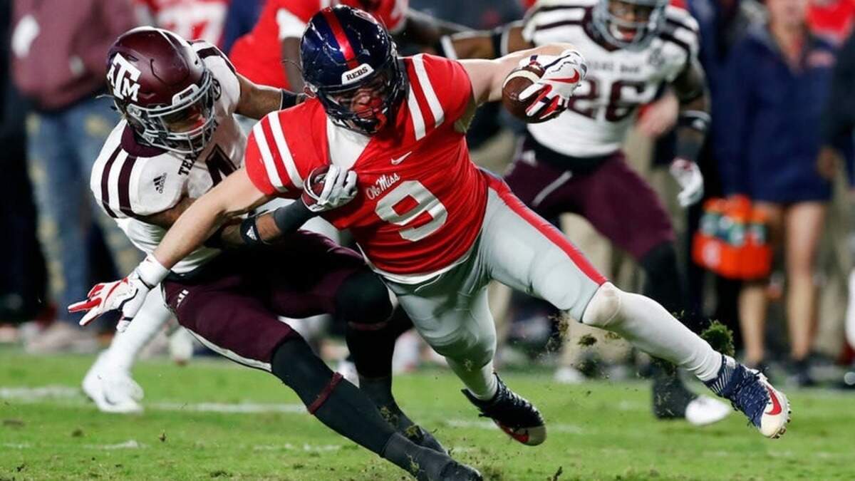 Mississippi wide receiver Tre Nixon (4) is tackled by Texas A&M defensive back Derrick Tucker (4) during the first half of an NCAA college football game in Oxford, Miss., Saturday, Nov. 18, 2017. Nixon was one of five former Rebels cleared by the NCAA to play elsewhere in 2018