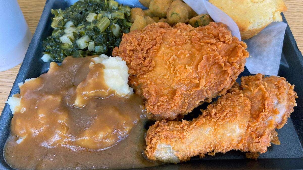 A “Meat and Three” lunch, like this from Minnie’s Uptown Restaurant in Columbus, Georgia that includes fried chicken, mashed potatoes and gravy, turnips, and fried okra is a well-known Southern tradition. 05/14/2024