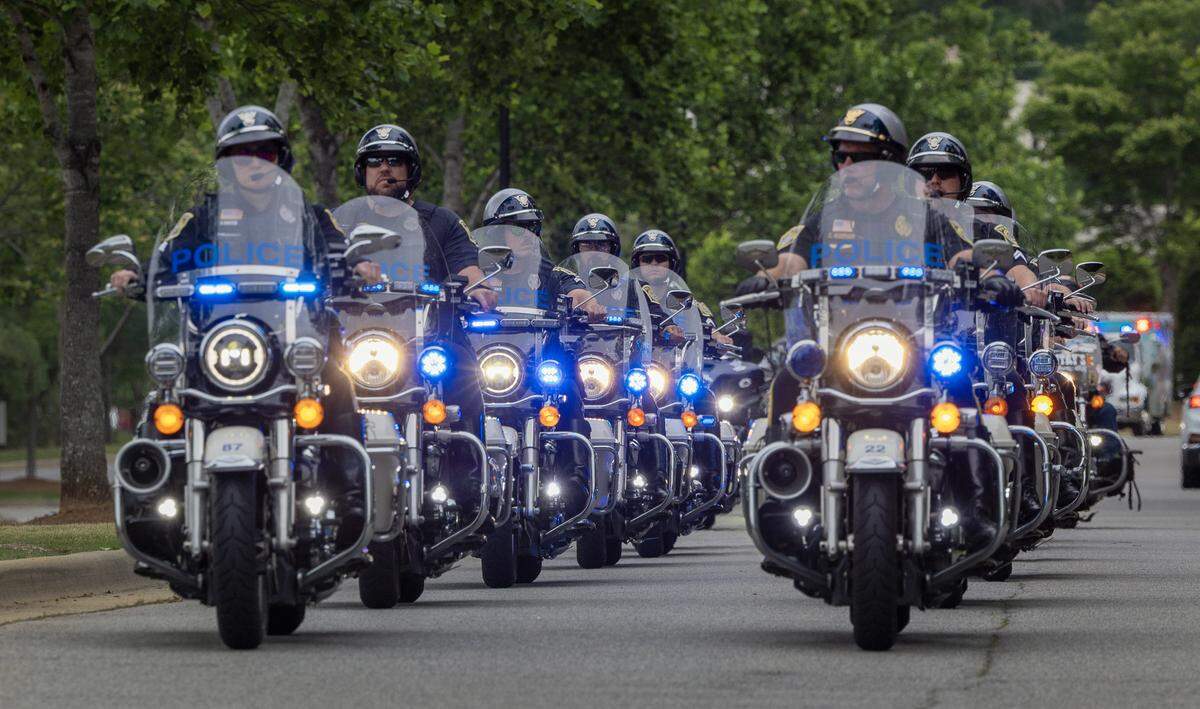 The Miracle Riders, led by this motorcycle escort by the Columbus Police Department, made the first stop on their 9,300-mile, Pony Express-themed ride from Columbus on May 1, 2026, at the National Infantry Museum and Soldier Center to read a postcard written by Ken Killingsworth about U.S. Army Sgt. 1st Class Alwyn Cashe, who was awarded the Medal of Honor for his actions during Operation Iraqi Freedom.