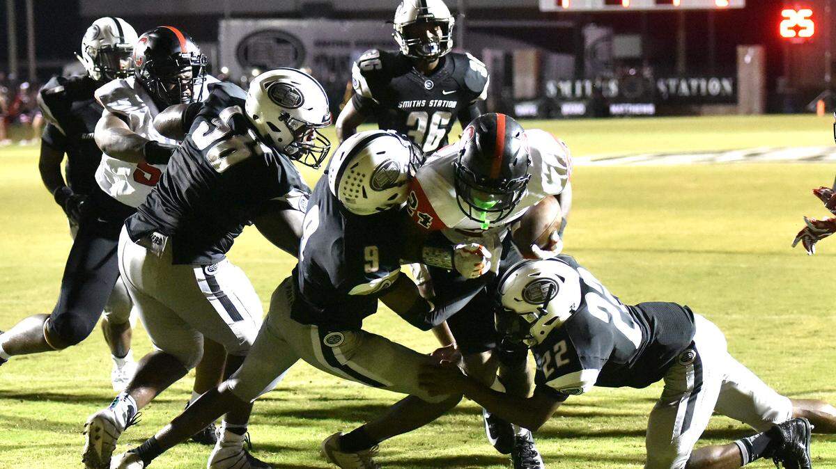 Central’s A’montae Spivey carries from the 7-yard line though several Smiths Station defenders into the end zone for Central’s 2nd touchdown of the game Friday night, September 7, 2018.