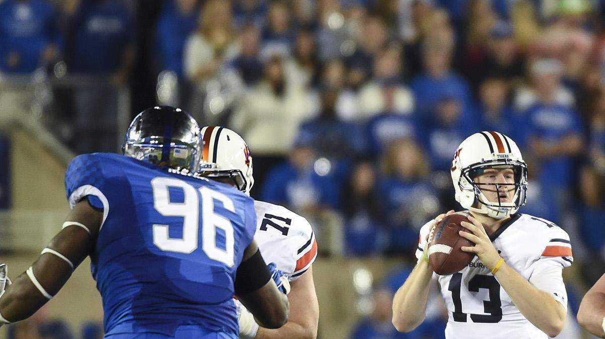 Auburn quarterback Sean White (13) steps back to throw at Kentucky in Lexington, Ky. on Thursday, Oct. 15, 2015. (Zach Bland/Auburn Athletics)