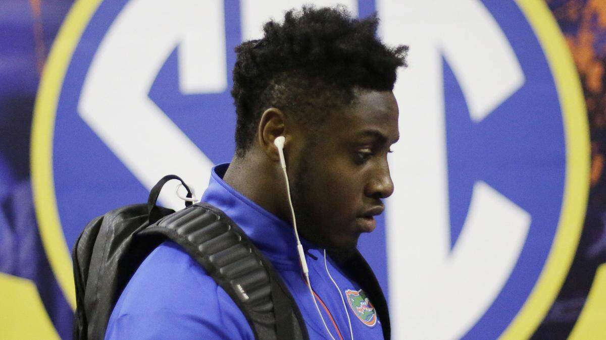 Florida linebacker Rayshad Jackson leaves the stadium after the Southeastern Conference championship NCAA college football game against Alabama, Saturday, Dec. 5, 2015, in Atlanta. Alabama won 29-15. (AP Photo/David Goldman)