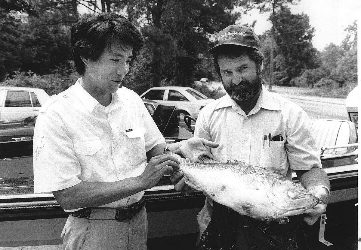 Phenix City resident Jack Chancellor (right) meets the Japanese Bass Fisherman of the Year in 1980.