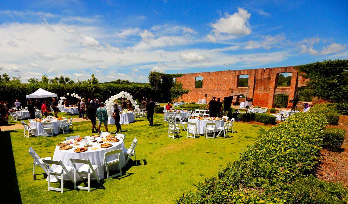 Crew members take a break between takes Monday afternoon while filming a scene for “Razor’s Edge” at the Bibb Mill Event Center in Columbus, Georgia. 07/11/2024