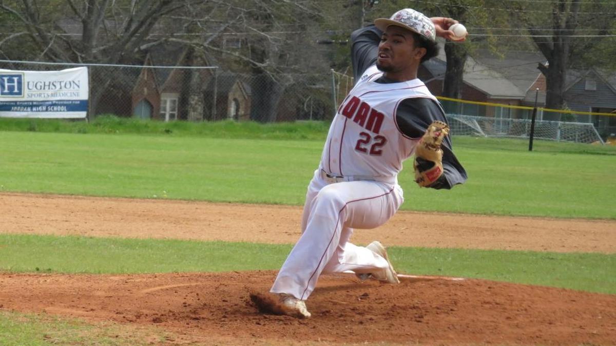 Jordan senior Eric Newman pitches against Marion County in the first game of a doubleheader against the Eagles at Jordan High School on March 11, 2017.